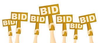golden hands holding signs that say BID